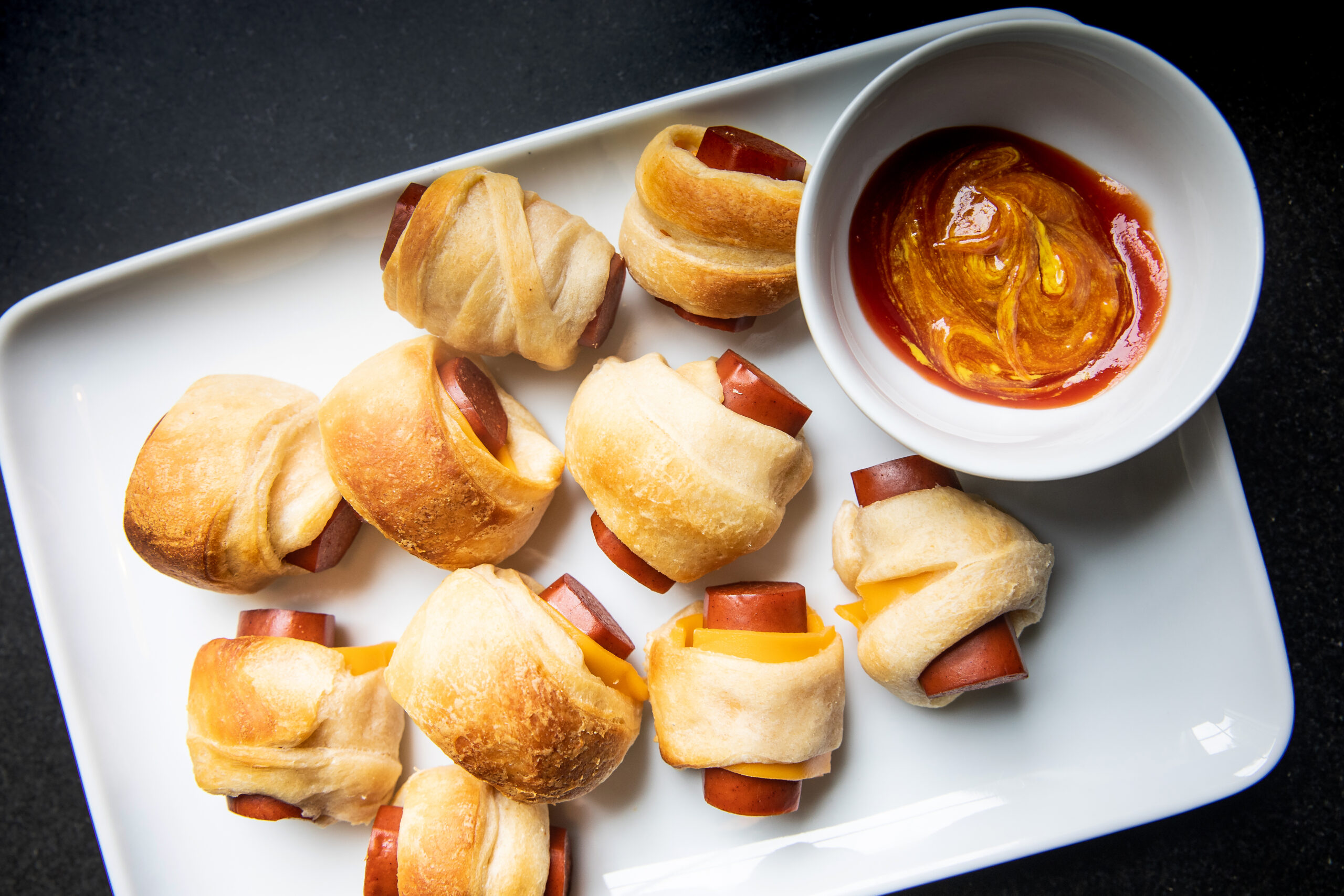 Cheesy Vegan Pigs in Blankets with Ketchup